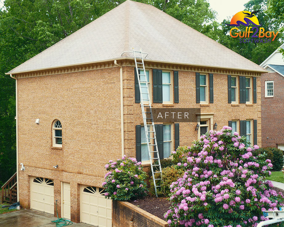 A two-story house after soft washing. Learn about us and our service.