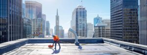 a bright, modern office space showcases a pristine roof maintenance service in action, featuring a technician skillfully cleaning a rooftop, with gleaming city skyscrapers visible in the background.